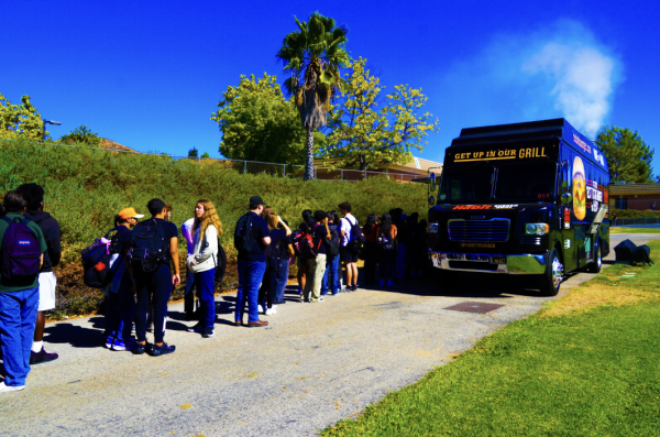 Seniors lined up to receive their meal.